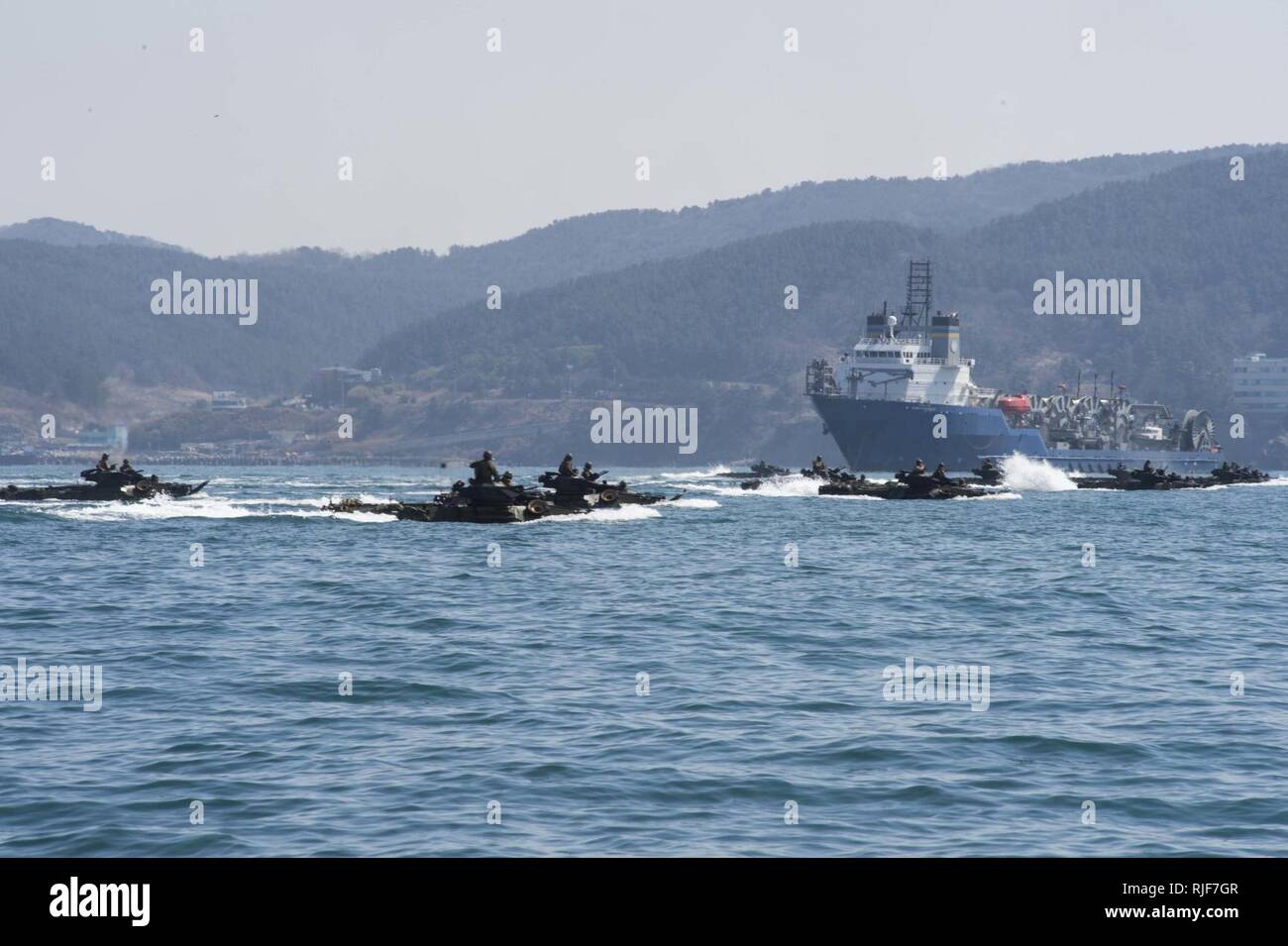 EAST SEA (March 12, 2016)- Amphibious assault vehicles (AAV), attached to the 31st Marine Expeditionary Unit (MEU) aboard amphibious dock landing ship USS Ashland (LSD 48), drive towards the beach during the amphibious capabilities exercise of Ssang Yong 16 (SY 16). Ashland is assigned to the Bonhomme Richard Expeditionary Strike Group and is participating in SY 16, a biennial combined amphibious exercise conducted by forward-deployed U.S. forces with the Republic of Korea navy and Marine Corps, Australian army and Royal New Zealand army forces in order to strengthen our interoperability and w Stock Photo