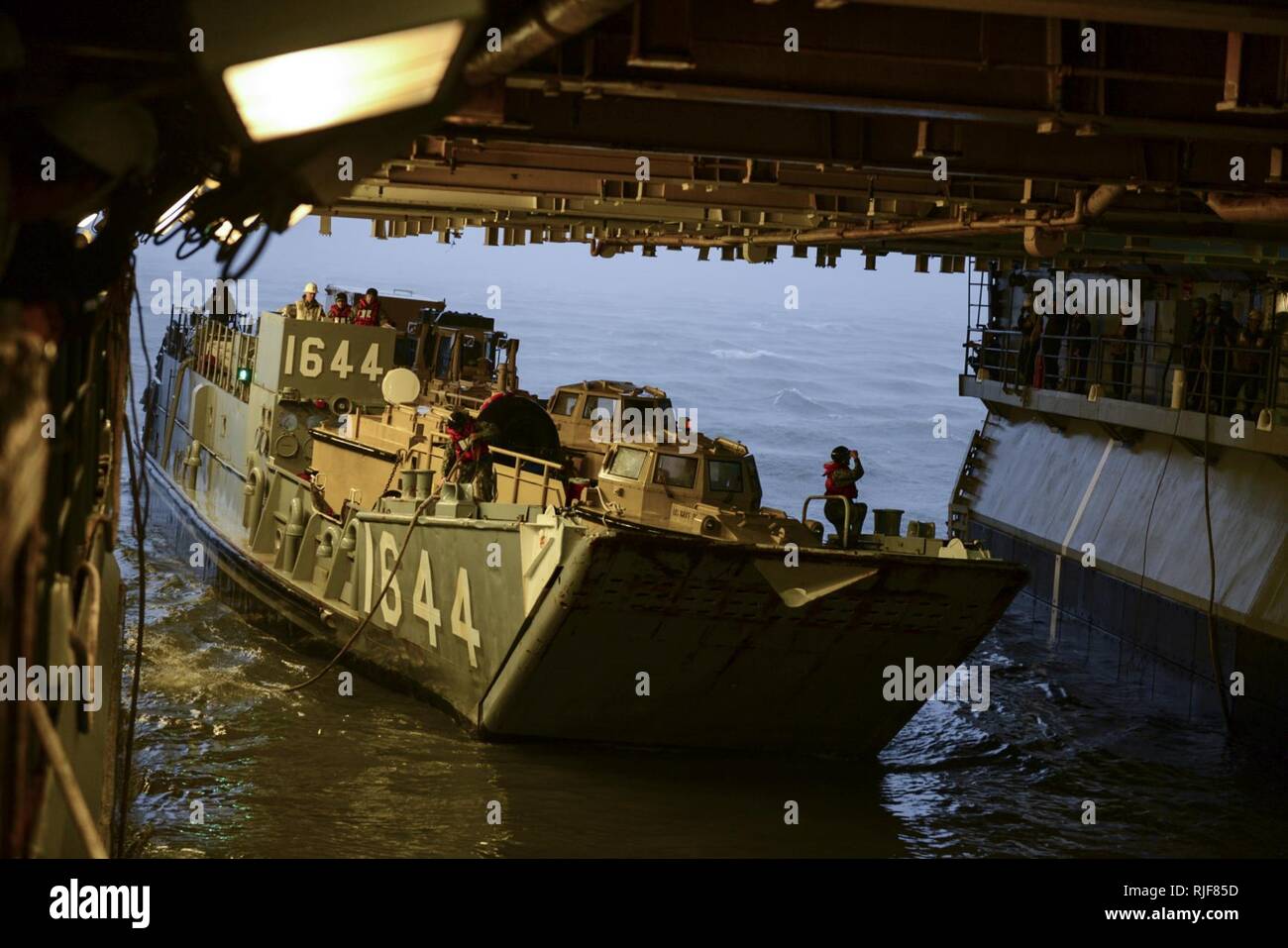 NORFOLK (Oct. 8, 2016) Landing Craft Utility (LCU) 1644, attached to Assault Craft Unit (ACU) 2, enters the well deck of the amphibious assault ship USS Iwo Jima (LHD 7). Iwo Jima and the 24th Marine Expeditionary Unit (24th MEU) are preparing to provide disaster relief and humanitarian aid to Haiti following Hurricane Matthew. Stock Photo
