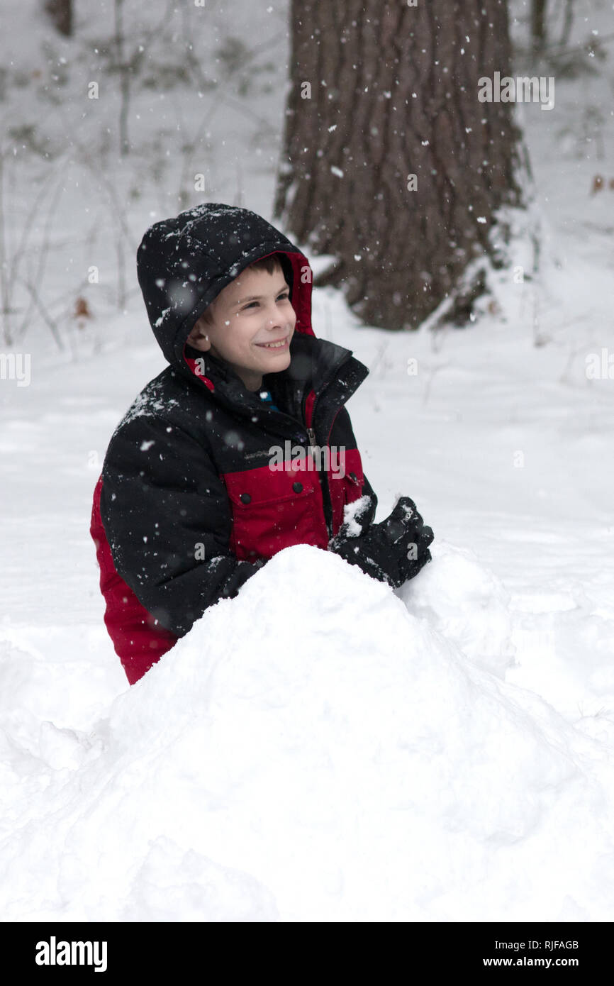 An elevenyearold boy playing in the snow Stock Photo Alamy