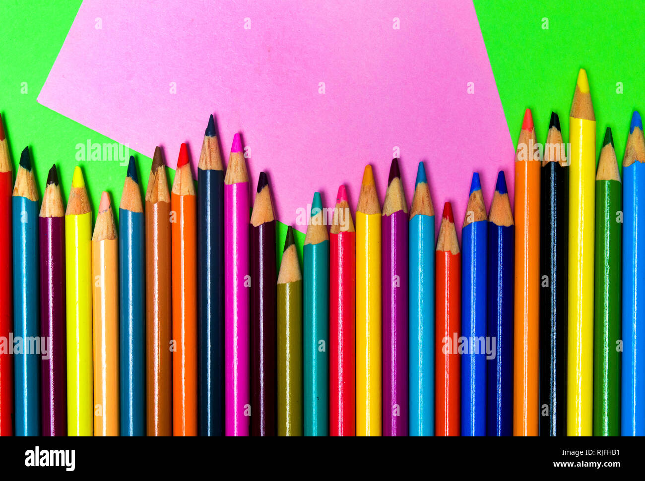 Colorful pencils on creative abstract background row Stock Photo