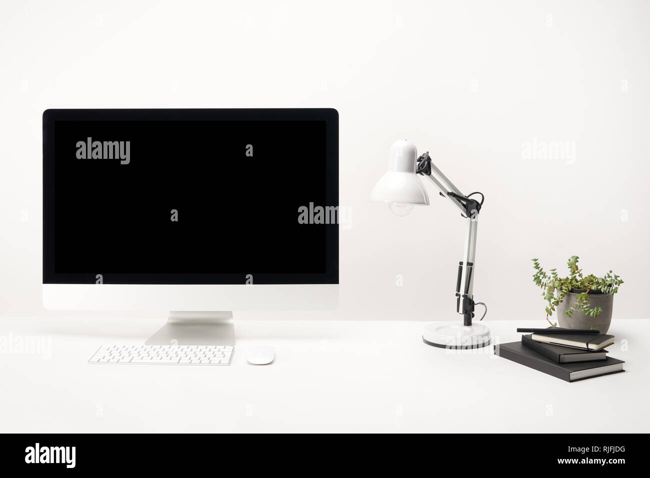 Workplace With Computer And Decoration And Lamp Free Stock Photo and Image  410769580