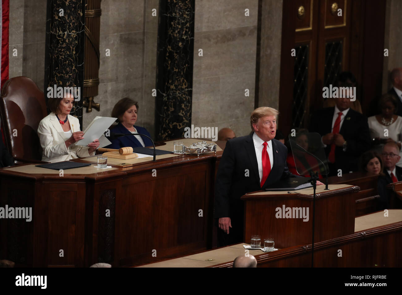 Washington, United States Of America. 05th Feb, 2019. Speaker of the United States House of Representatives Nancy Pelosi (Democrat of California), left, follows the text as US President Donald J. Trump delivers his second annual State of the Union Address to a joint session of the US Congress in the US Capitol in Washington, DC on Tuesday, February 5, 2019. Credit: Alex Edelman/CNP | usage worldwide Credit: dpa/Alamy Live News Stock Photo