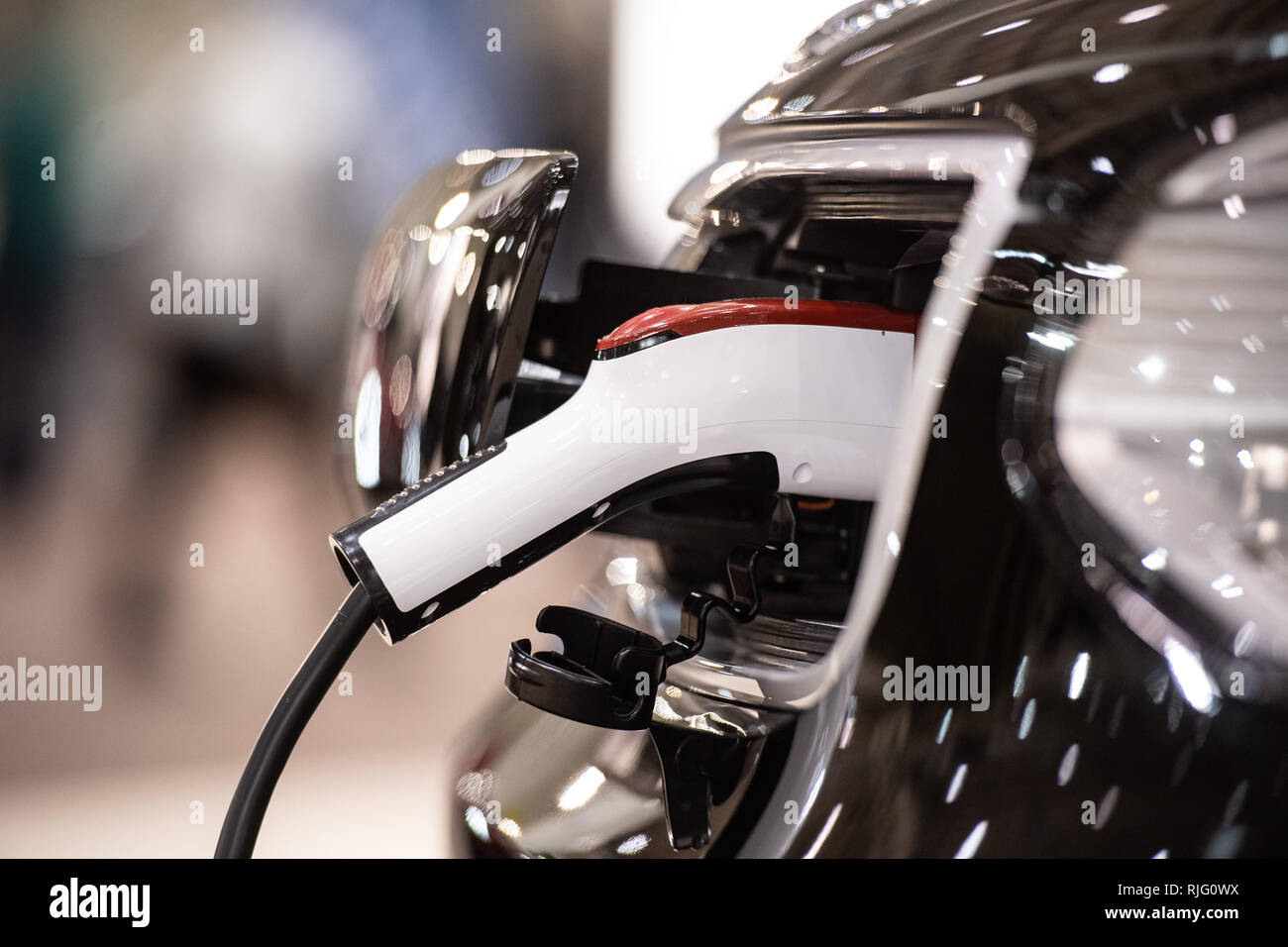 Hamburg, Germany. 06th Feb, 2019. At the Hamburg travel and leisure fair 'oohh!', a charging plug is plugged into a Kia Soul Play electric car. The fair will take place from 6 to 10 February. Credit: Daniel Reinhardt/dpa/Alamy Live News Stock Photo