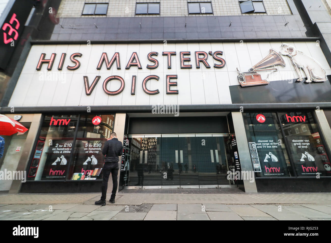 London, UK. 6th Feb, 2019. Pedestrians walk past the closed HMV flagship store in Oxford Street. The Collapsed music chain HMV His Master's Voice has been bought by Canadian firm Sunrise Records who has beaten off competition from Sports Direct owner Mike Ashley. Sunrise Records plans to buy 100 stores out of administration, securing 1,487 jobs although 27 stores will close, resulting in 455 redundancies. The first HMV-branded store was opened by the Gramophone Company on Oxford Street in 1921 Credit: amer ghazzal/Alamy Live News Stock Photo