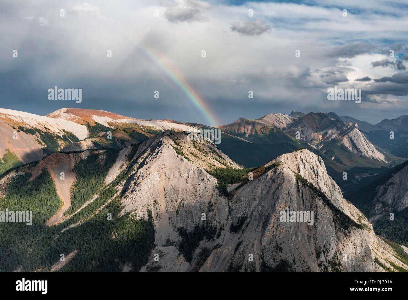 Panoramic view on mountain landscape with rainbow, peaks with orange sulphur deposits, untouched nature, Sulphur Skyline Stock Photo