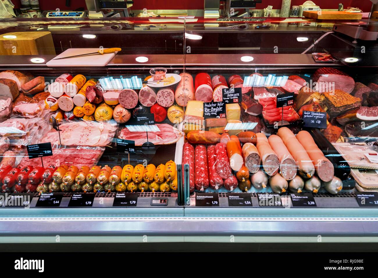 Sausage counter with sausage products in the supermarket, Munich, Upper Bavaria, Bavaria, Germany Stock Photo