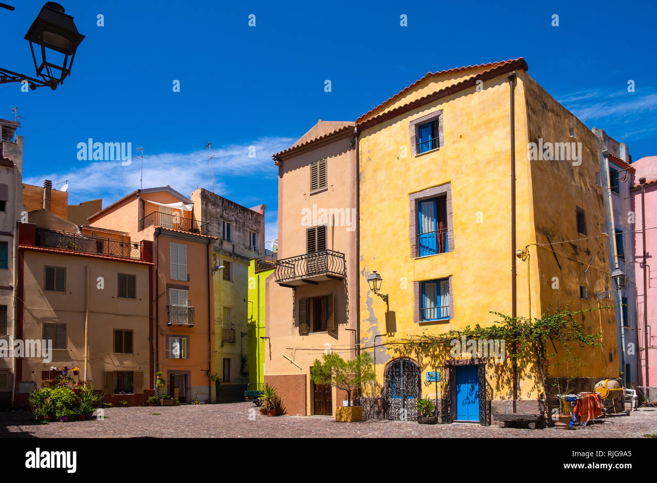 Bosa, Sardinia / Italy - 2018/08/13: Summer view of the Bosa old town quarter with historic colorful tenements and streets Stock Photo