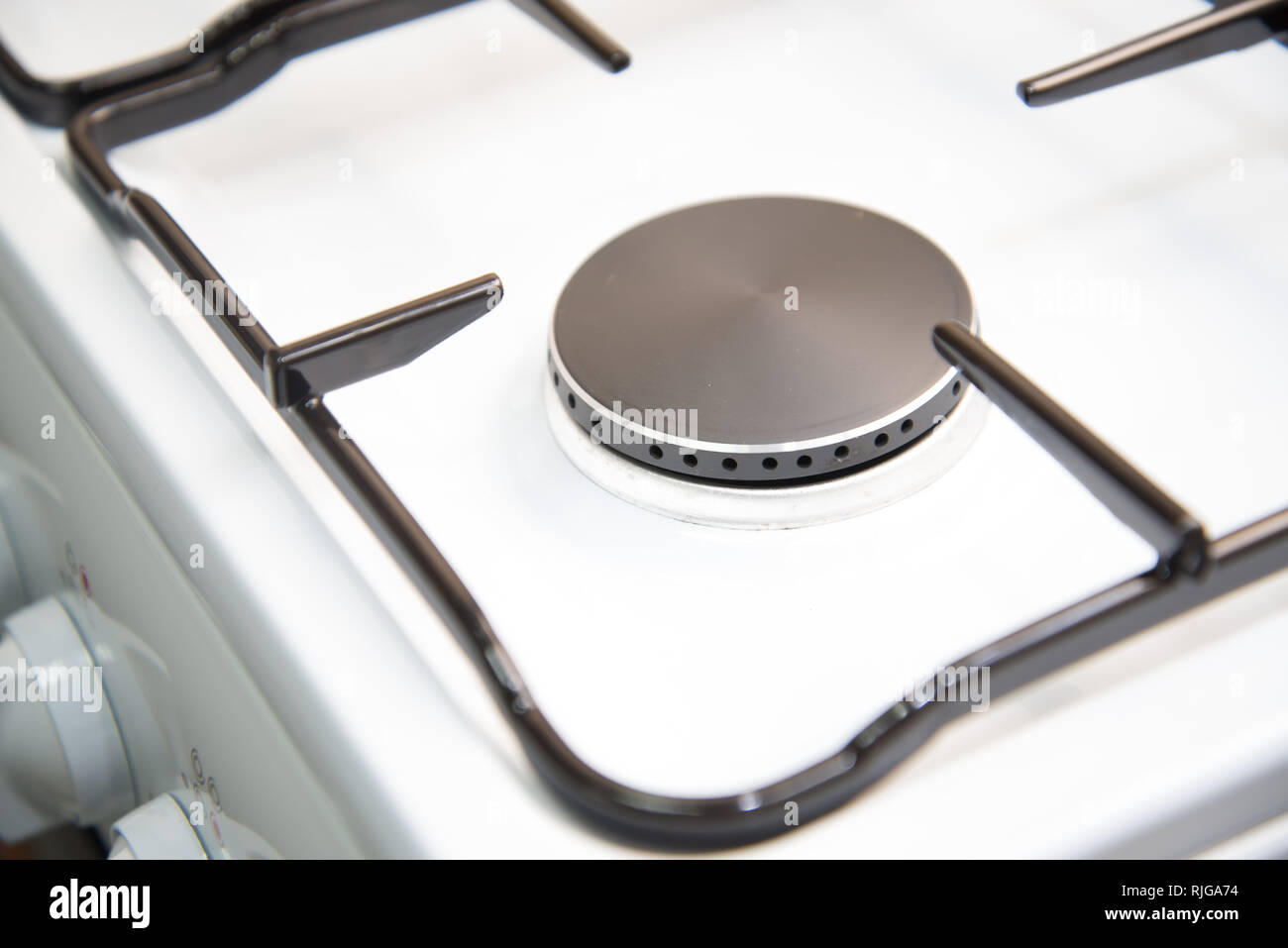 Closeup clean new kitchen gas stove cooker knob heat volume switch