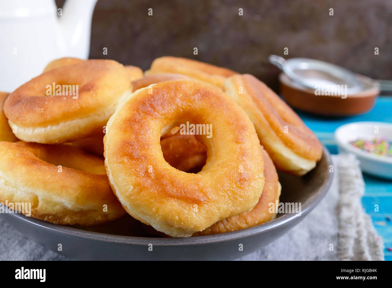 Homemade classic donuts with powdered sugar in the plate. Stock Photo