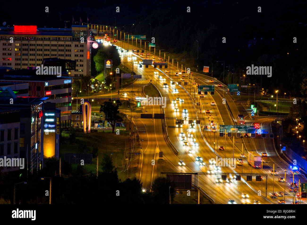 Illuminated road at night Stock Photo