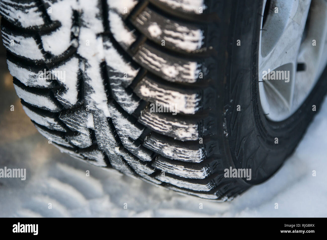 Car tire at winter, close-up Stock Photo