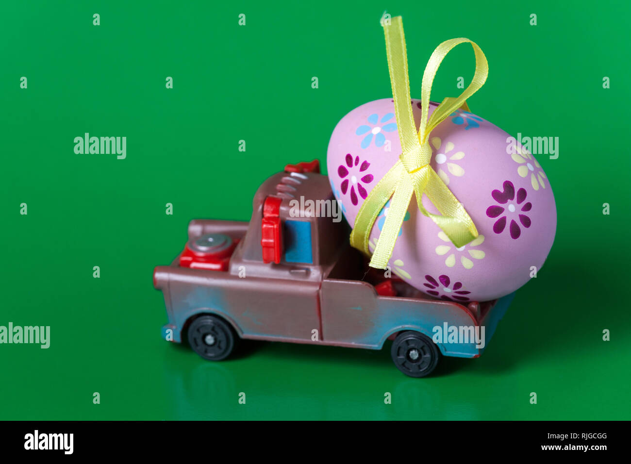 Easter egg on the car a green background Stock Photo Alamy