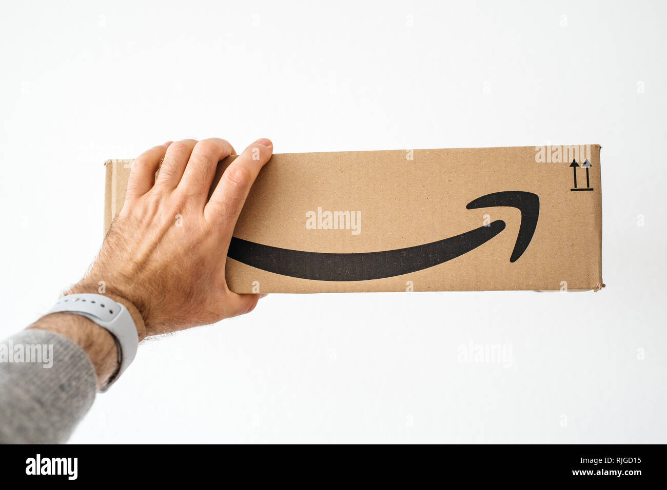 PARIS, FRANCE APR 16, 2018 Man holding against white background