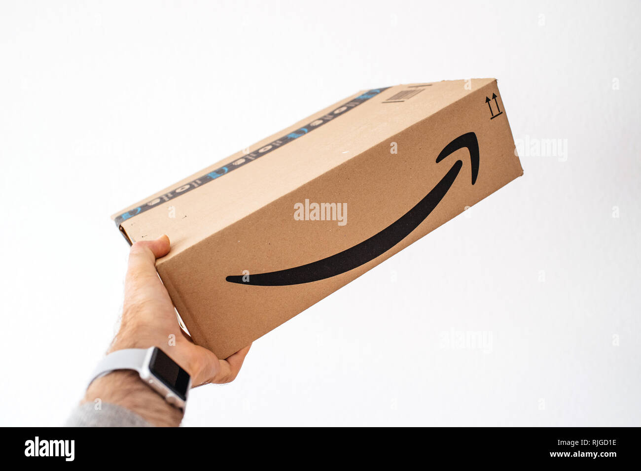 PARIS, FRANCE APR 16, 2018 Man holding against white background