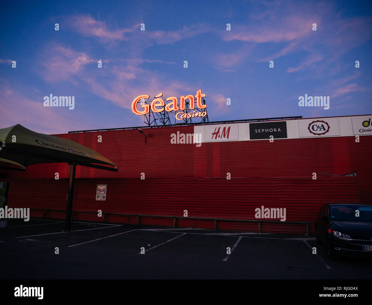 POTIRERS, FRANCE - JUN 27, 2018: Neon sign of the large supermarket chain Casino Geant - Giant Casino in France at dusk Stock Photo