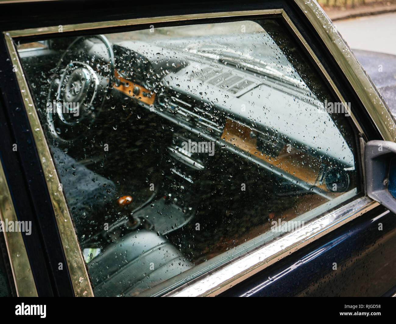 Detail of old vintage American car side window covered with raindrops Hamburg, Germany Stock