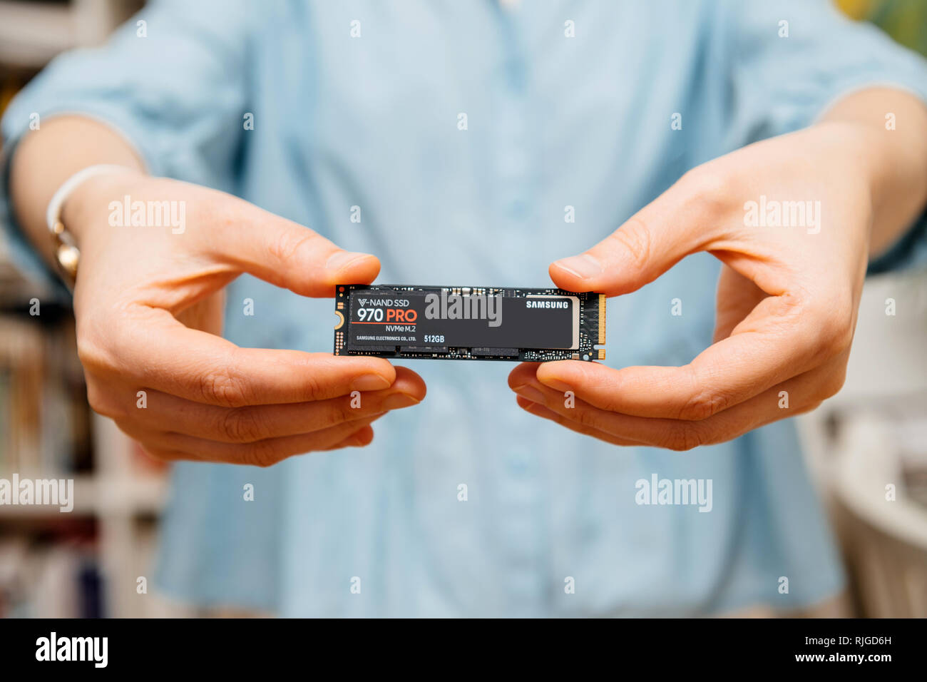 PARIS, FRANCE - AUG 3, 2018: Woman hands holding new Samsung 870 Pro NVME PCIE SSD hard drive disk with high read and write speed Samsung 870 Pro  Stock Photo