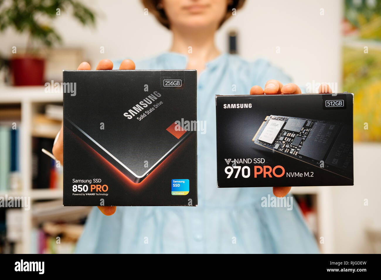 PARIS, FRANCE - AUG 3, 2018: Woman hands holding new NVME PCIE SSD hard  drive disk with high read and write speed Samsung 870 Pro compare to  Samsung 860 SSD Stock Photo - Alamy