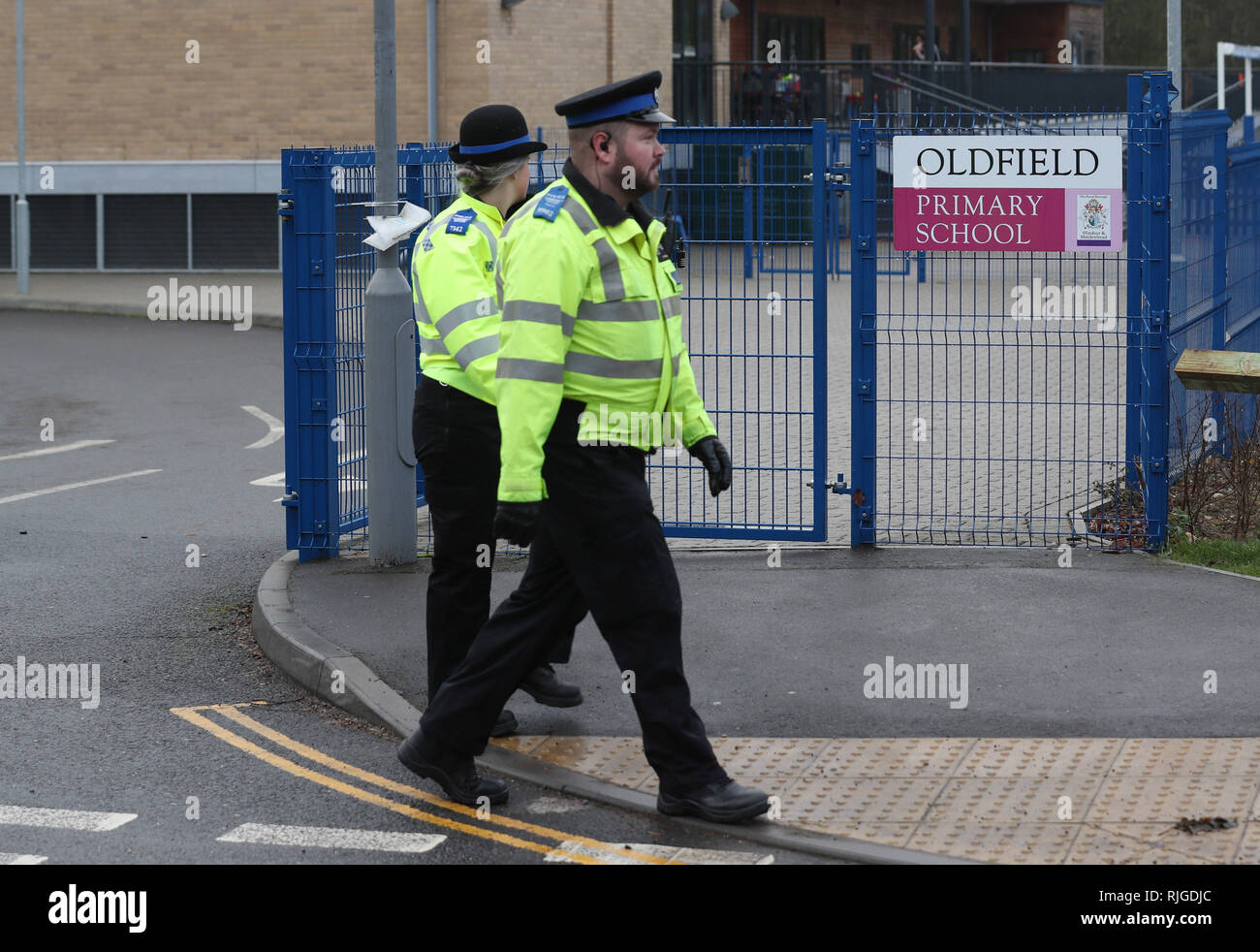Police officers outside Oldfield Primary School in Bray, Maidenhead, as officials are probing a report that disgraced entertainer Rolf Harris walked onto the grounds of the school and waved at pupils. Stock Photo