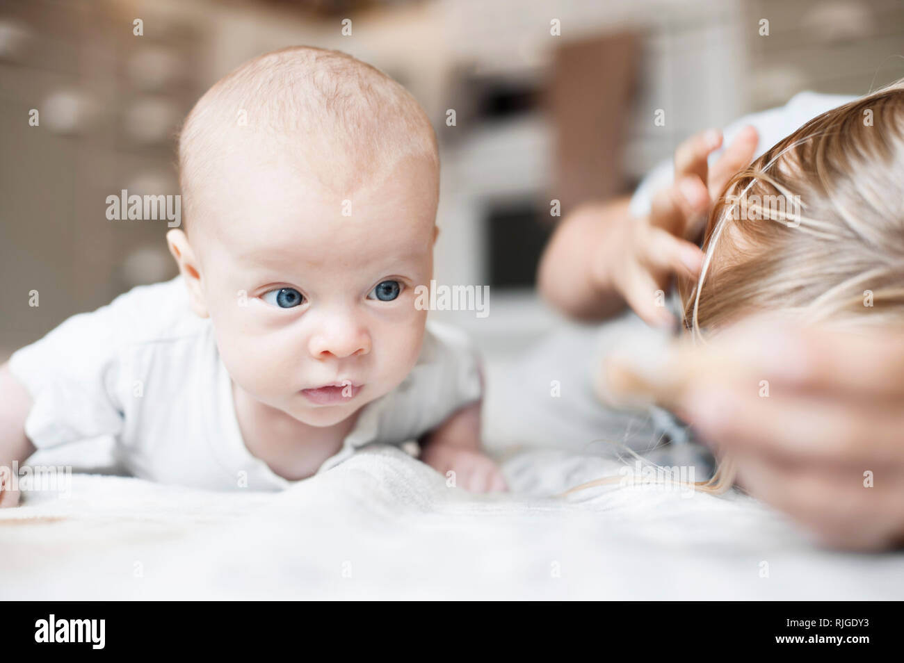 Baby on bed Stock Photo Alamy