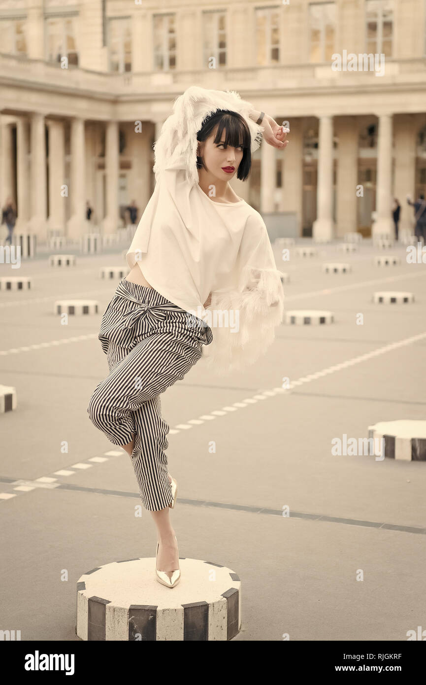 Woman wearing high heels shoes on legs and pose in Paris, France Stock
