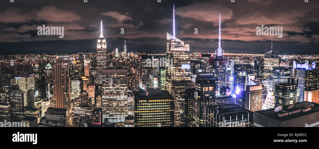 The iconic New York Skyline by night as seen from a skyscraper, Manhattan, NCY, USA Stock Photo