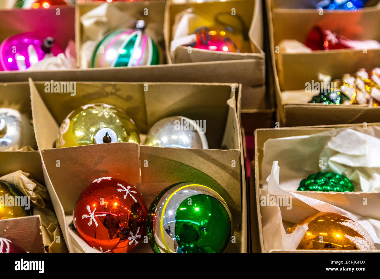 Christmas balls in paper boxes Stock Photo Alamy