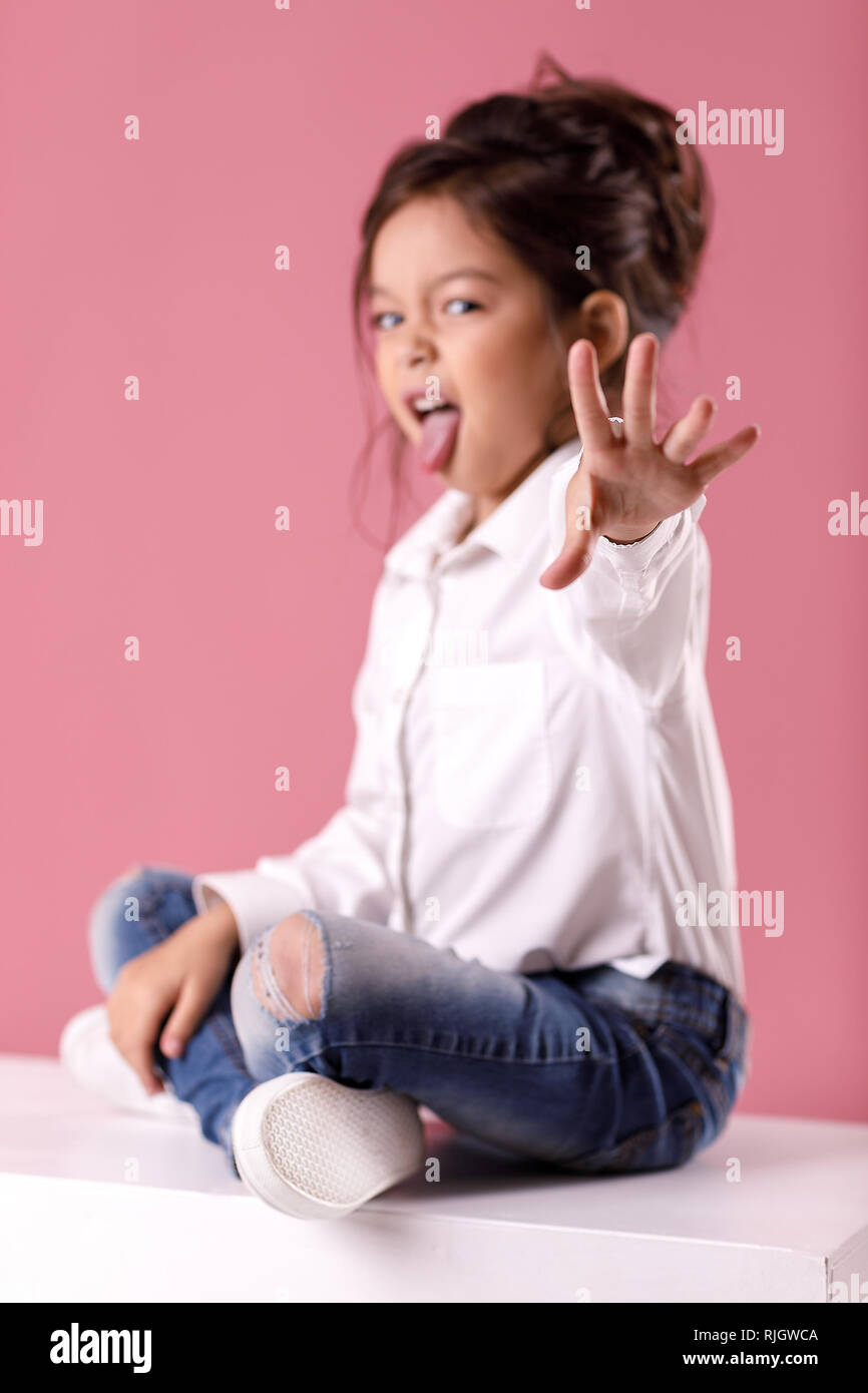 Cute Little Child Girl In White Shirt With Hairstyle Showing