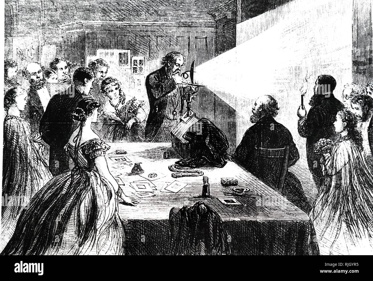 An engraving depicting a photographer taking photos by magnesium light. Dated 19th century Stock Photo