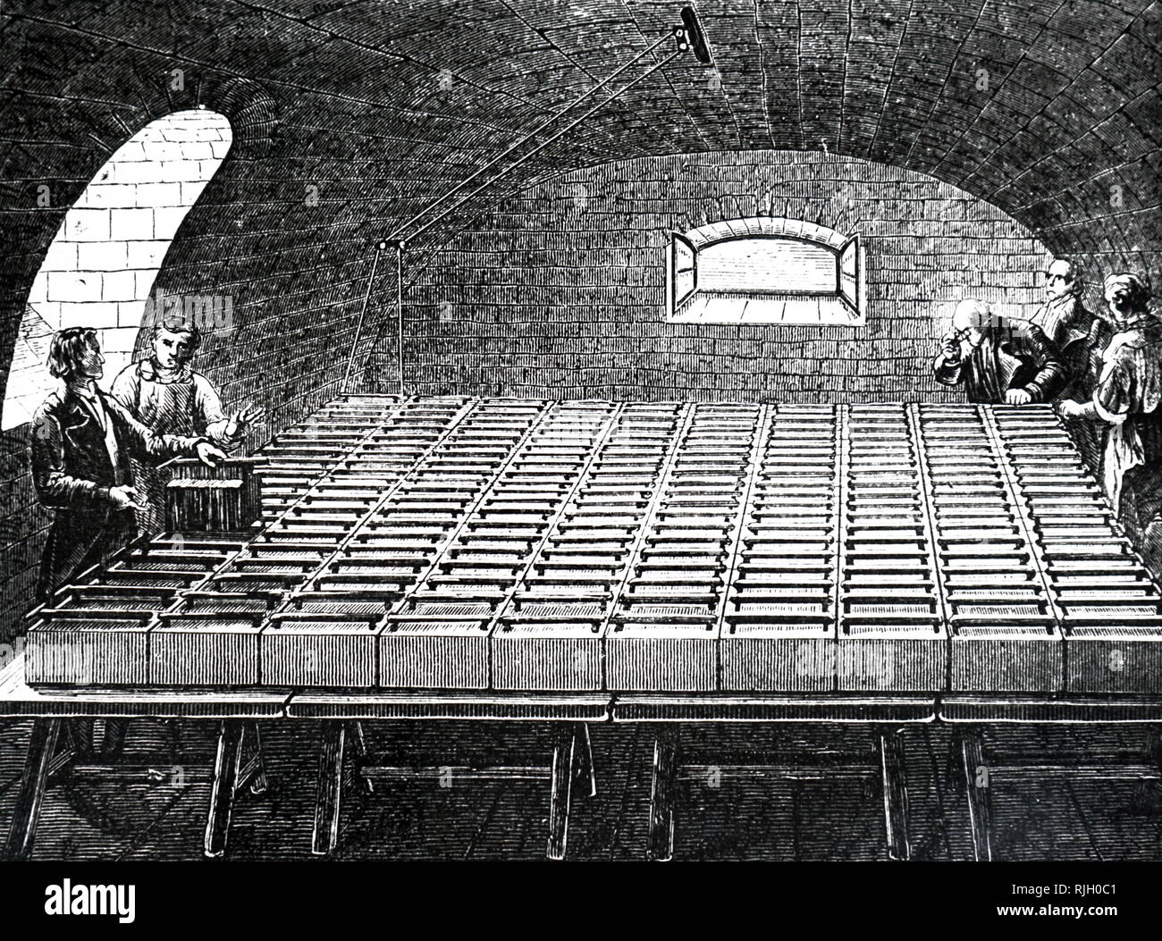 An engraving depicting the giant battery built in the basement of The Royal Institution of Great Britain, an organisation devoted to scientific education and research. Dated 19th century Stock Photo