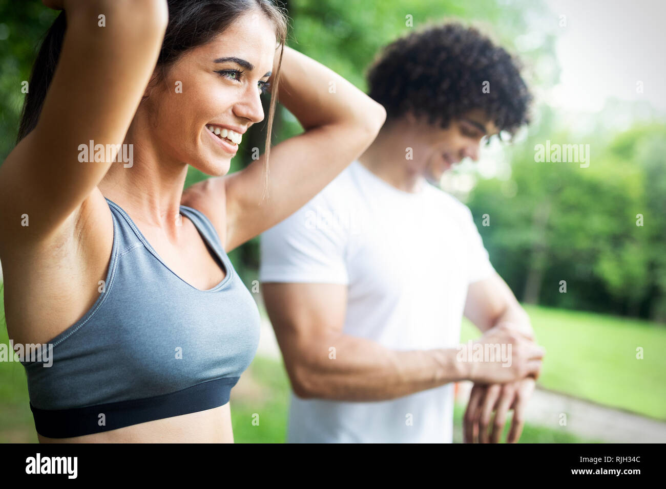 Happy couple running and jogging together outdoor Stock Photo - Alamy