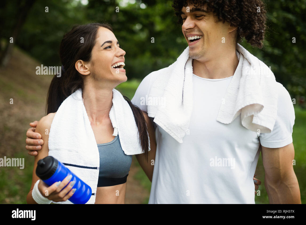 Happy couple running and jogging together outdoor Stock Photo - Alamy