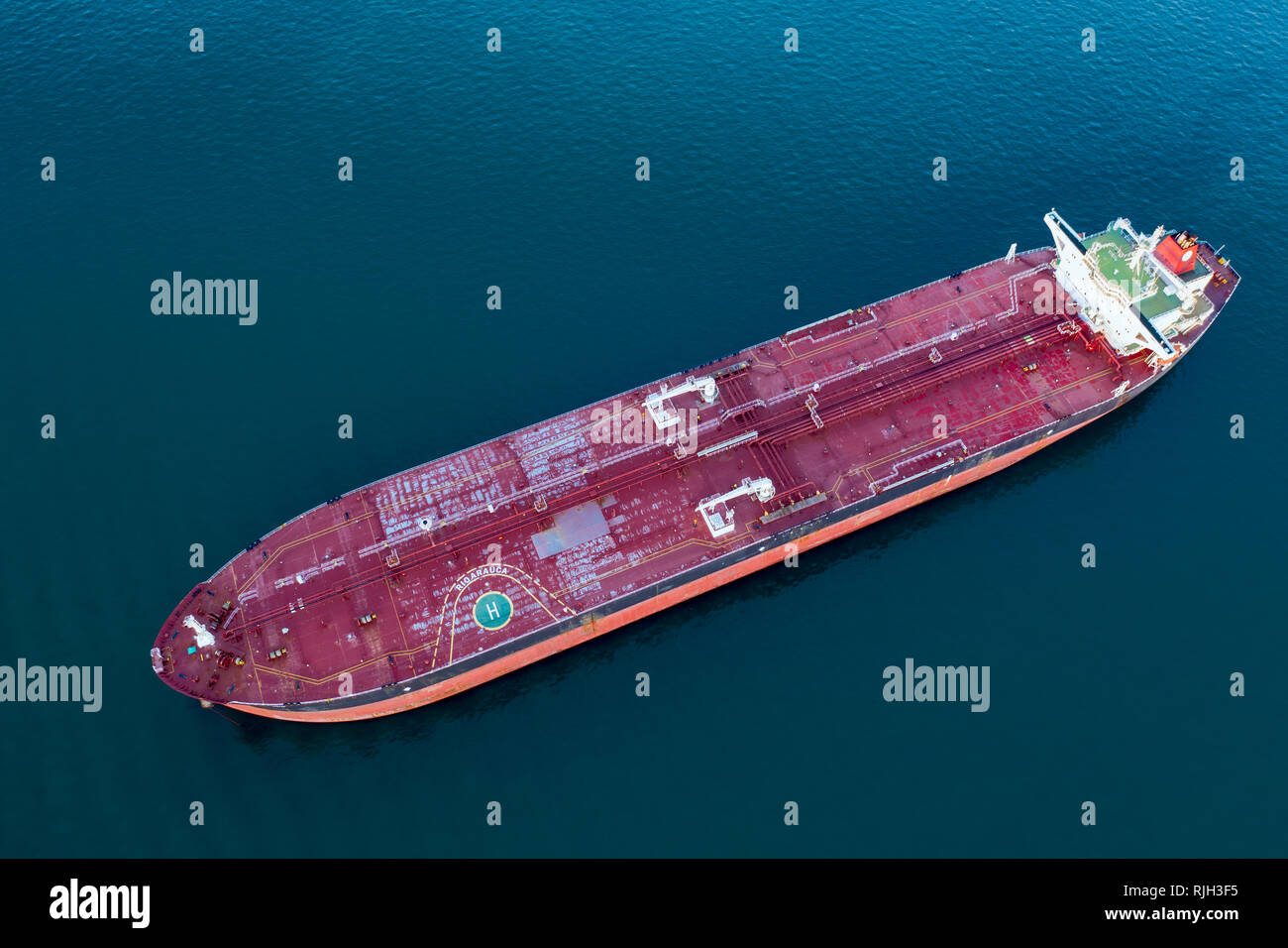 Aerial drone view of red empty cargo ship in the ocean Stock Photo - Alamy
