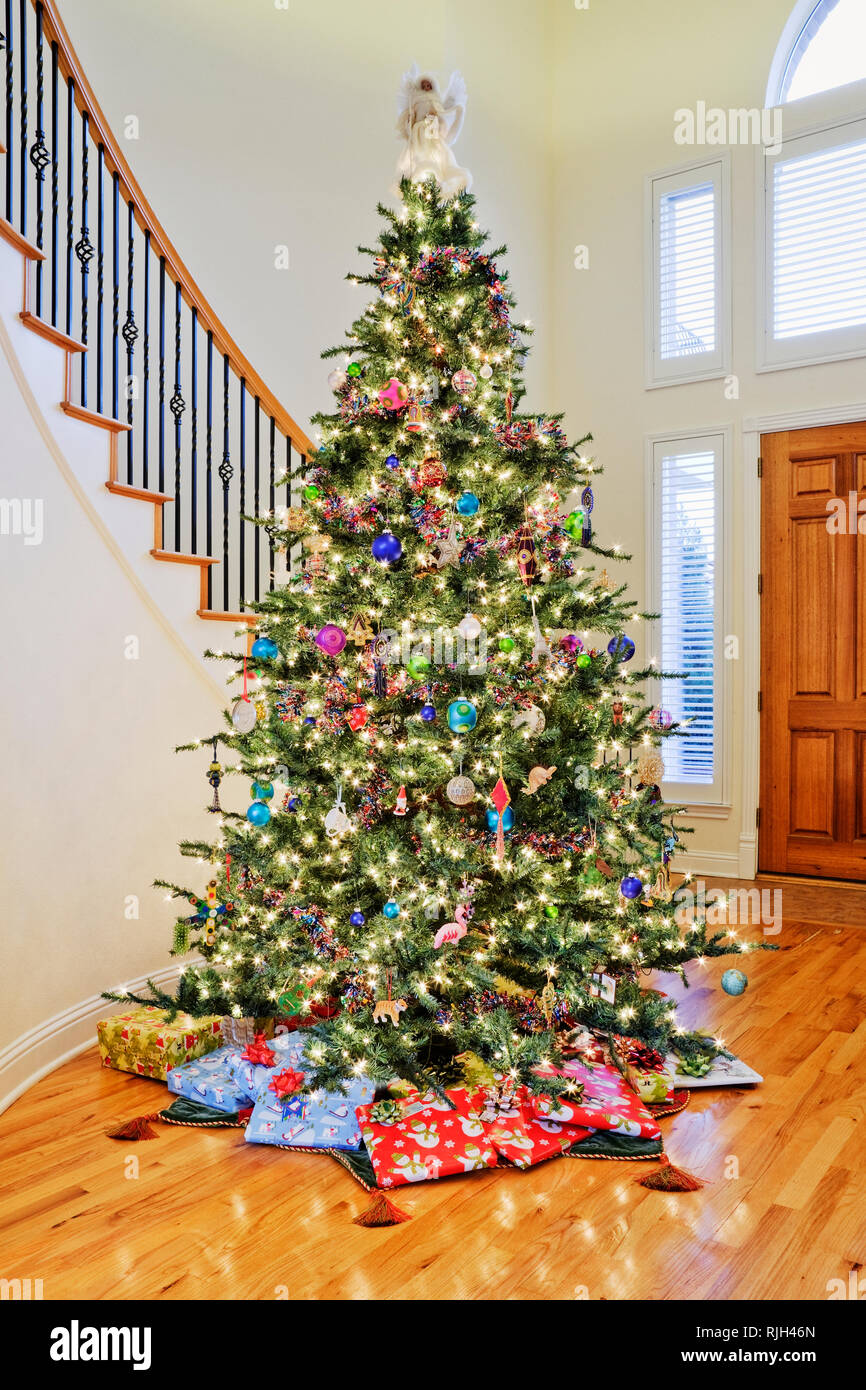 Tall christmas tree with presents hi-res stock photography and images ...