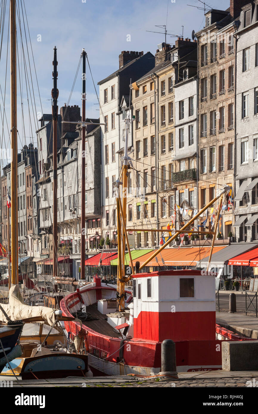 Colourful sailing boats moored on St. Catherine's Quay by the old harbour in Honfleur, Normandy, France. Stock Photo