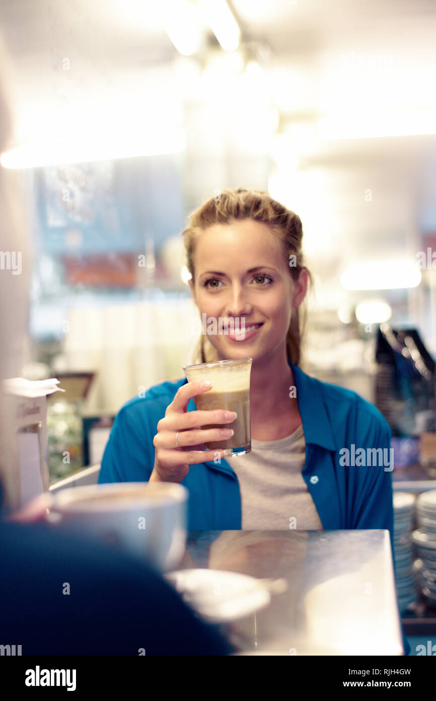 Smiling woman in cafe Stock Photo