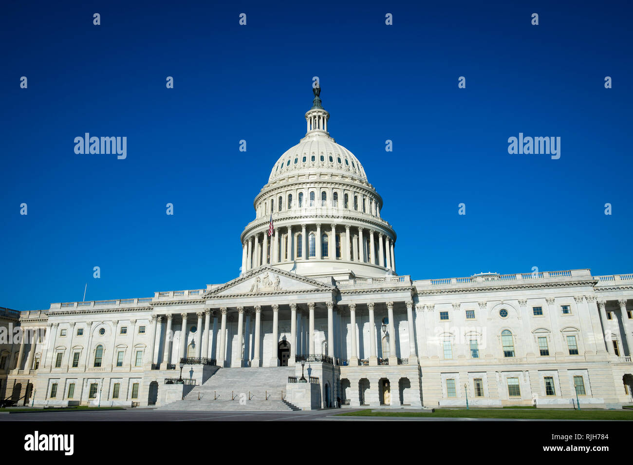 Bright morning view of the traditional neoclassical architecture of the Capitol Building’s dome, columns, and steps in Washington DC, USA Stock Photo