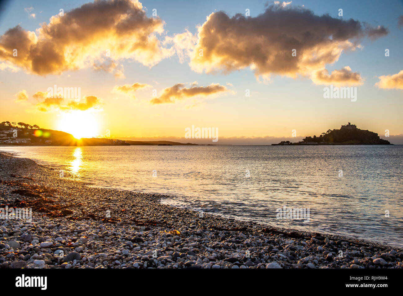 Coastal Sunrise over Beach adjacent to saint Michaels mount - Long Rock - Cornwall Stock Photo