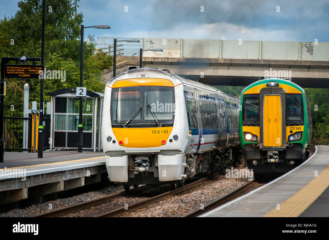 Class 172 Turbostar passenger train in London Midland livery with a class 168 Clubman in Chiltern Railways livery. Stock Photo