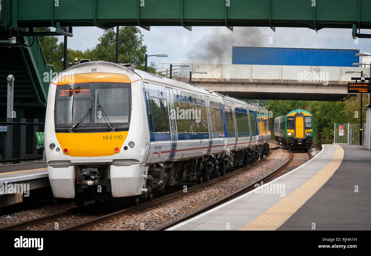 Class 172 Turbostar passenger train in London Midland livery with a class 168 Clubman in Chiltern Railways livery. Stock Photo