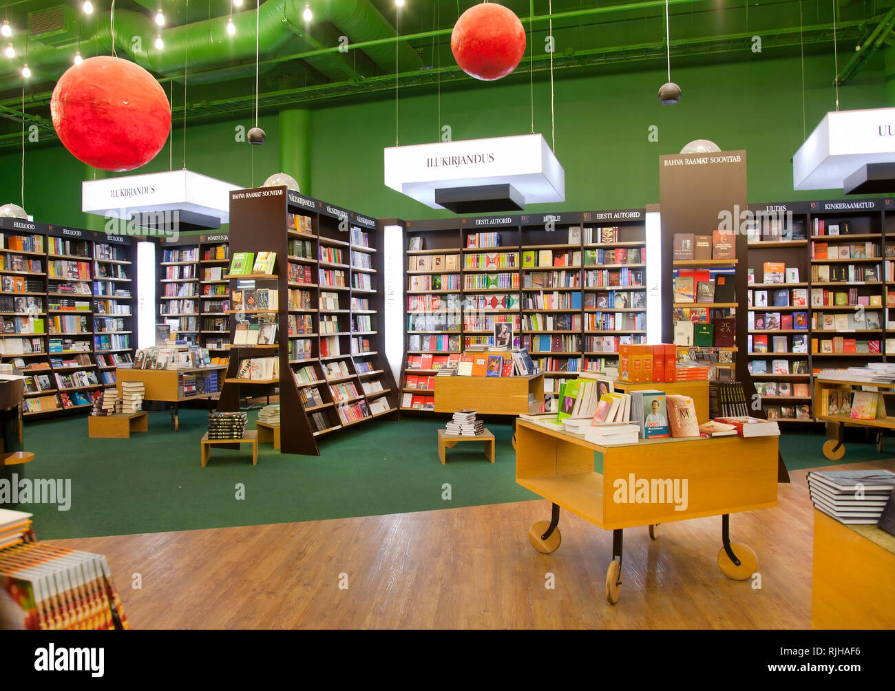 Books on shelves and tables in bookstore Stock Photo