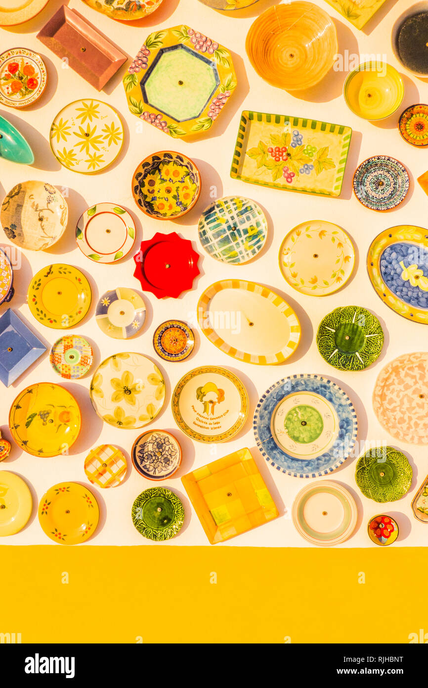 traditional handpainted pottery attached to the facade of a shop