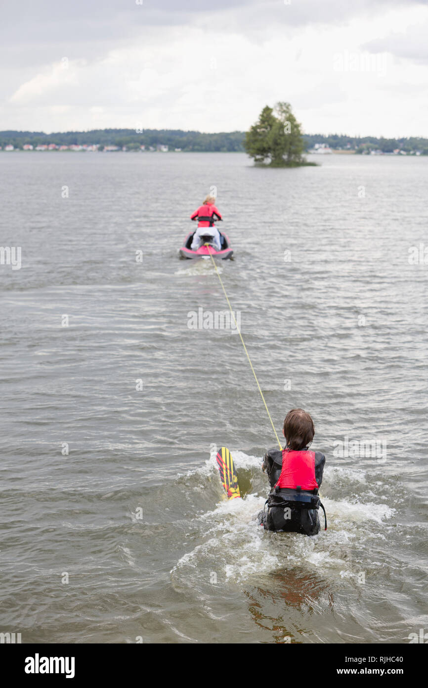 Jet ski pulling water skier Stock Photo