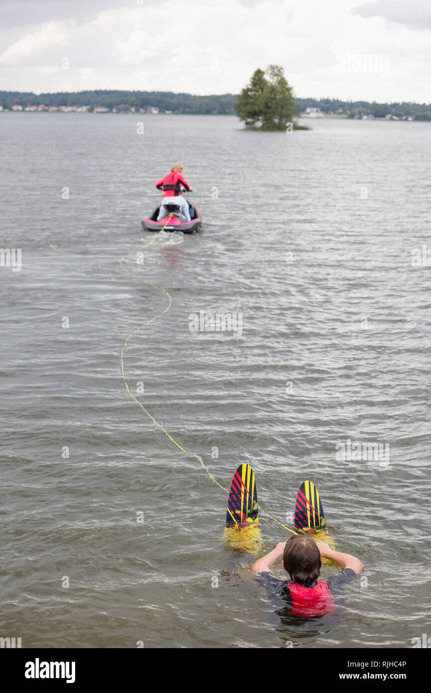 Jet ski pulling water skier Stock Photo Alamy