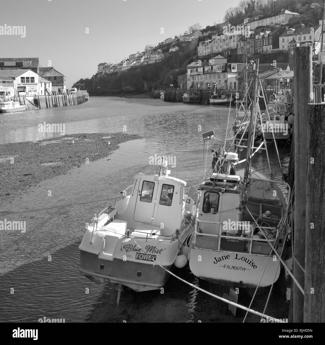Berthed boats at West Looe, seaside town in south east Cornwall UK Stock Photo