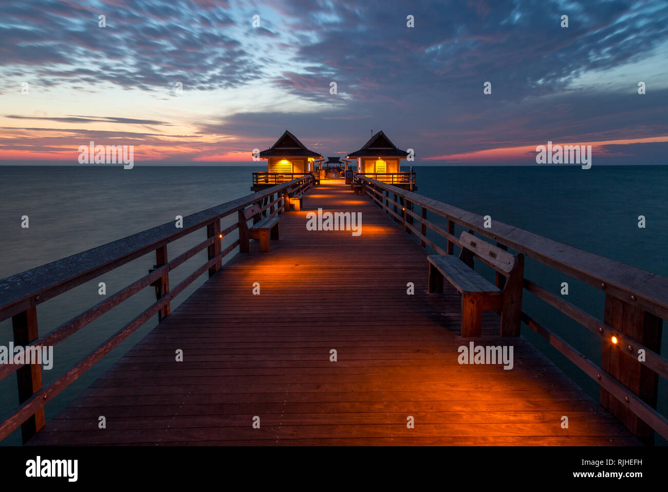 Twilight over the Gulf of Mexico at the Naples Pier along Florida's Gulf Coast, Naples, Florida, USA Stock Photo