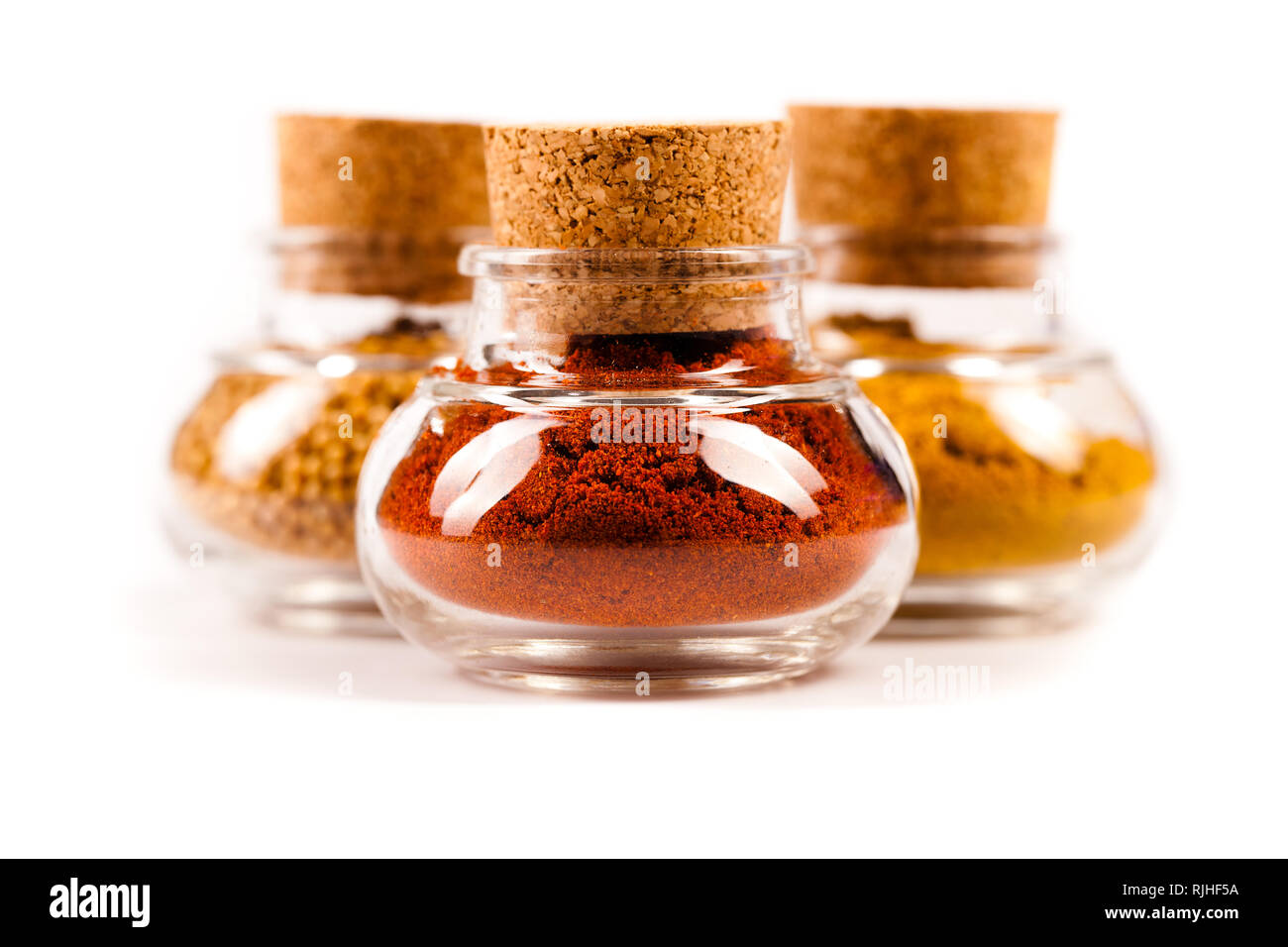little jars of spices on white background Stock Photo Alamy