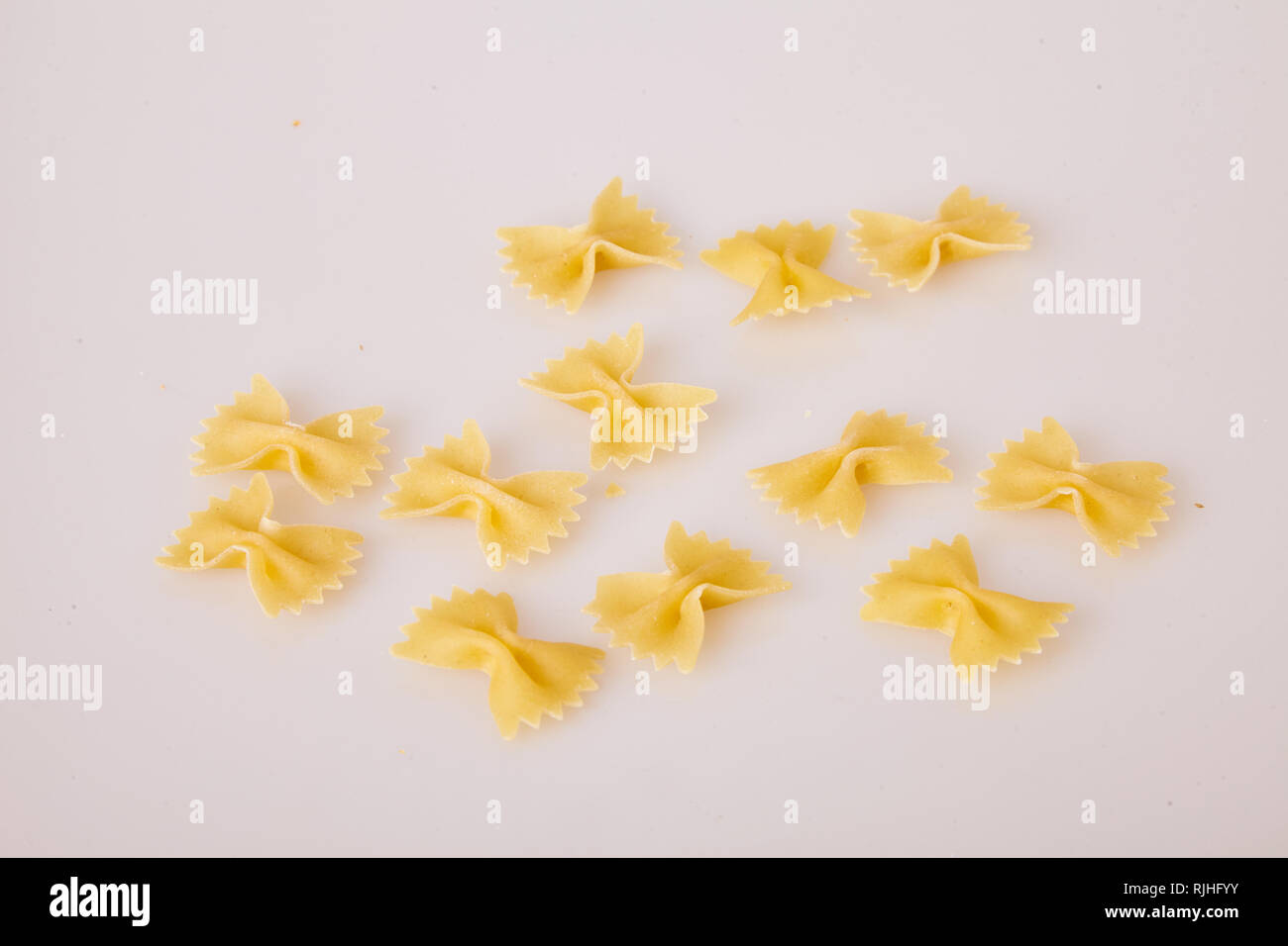 bow tie pasta isolated on white background, top view. Farfalle Pasta