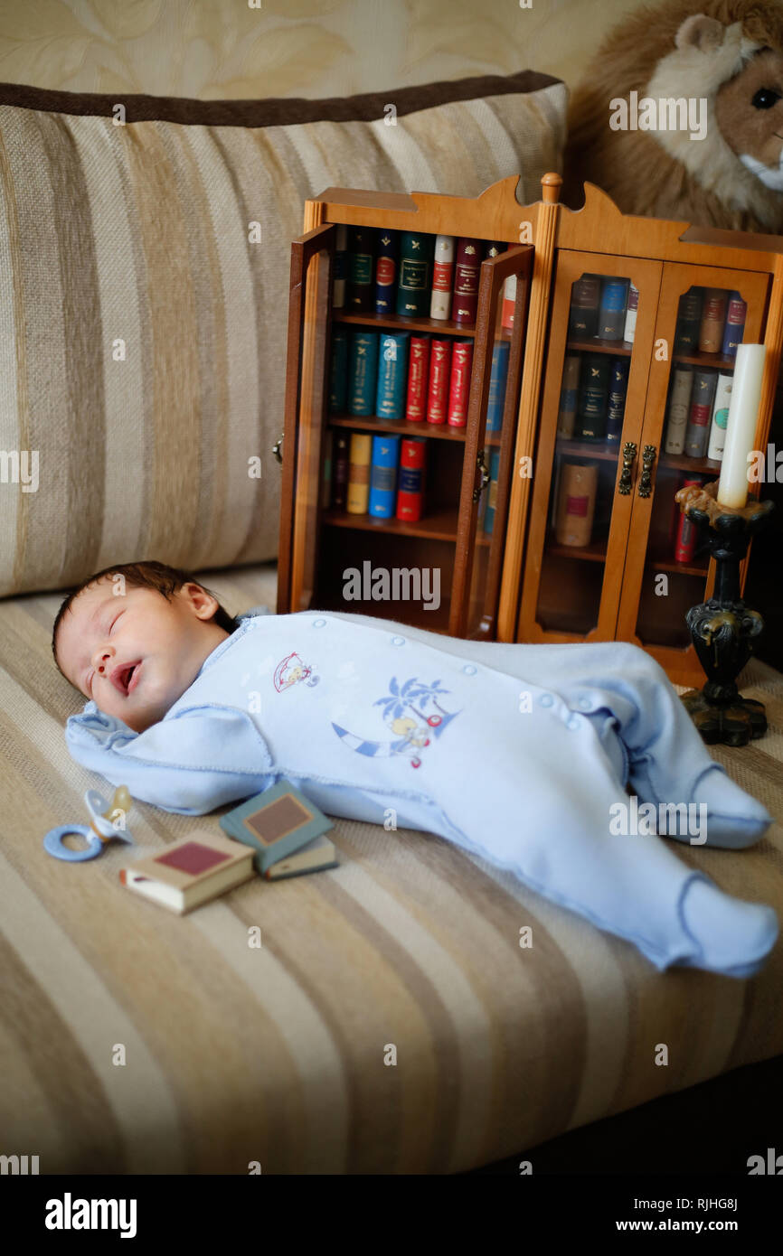 The Child Fell Asleep On The Couch Reading A Book With Fairy Tales