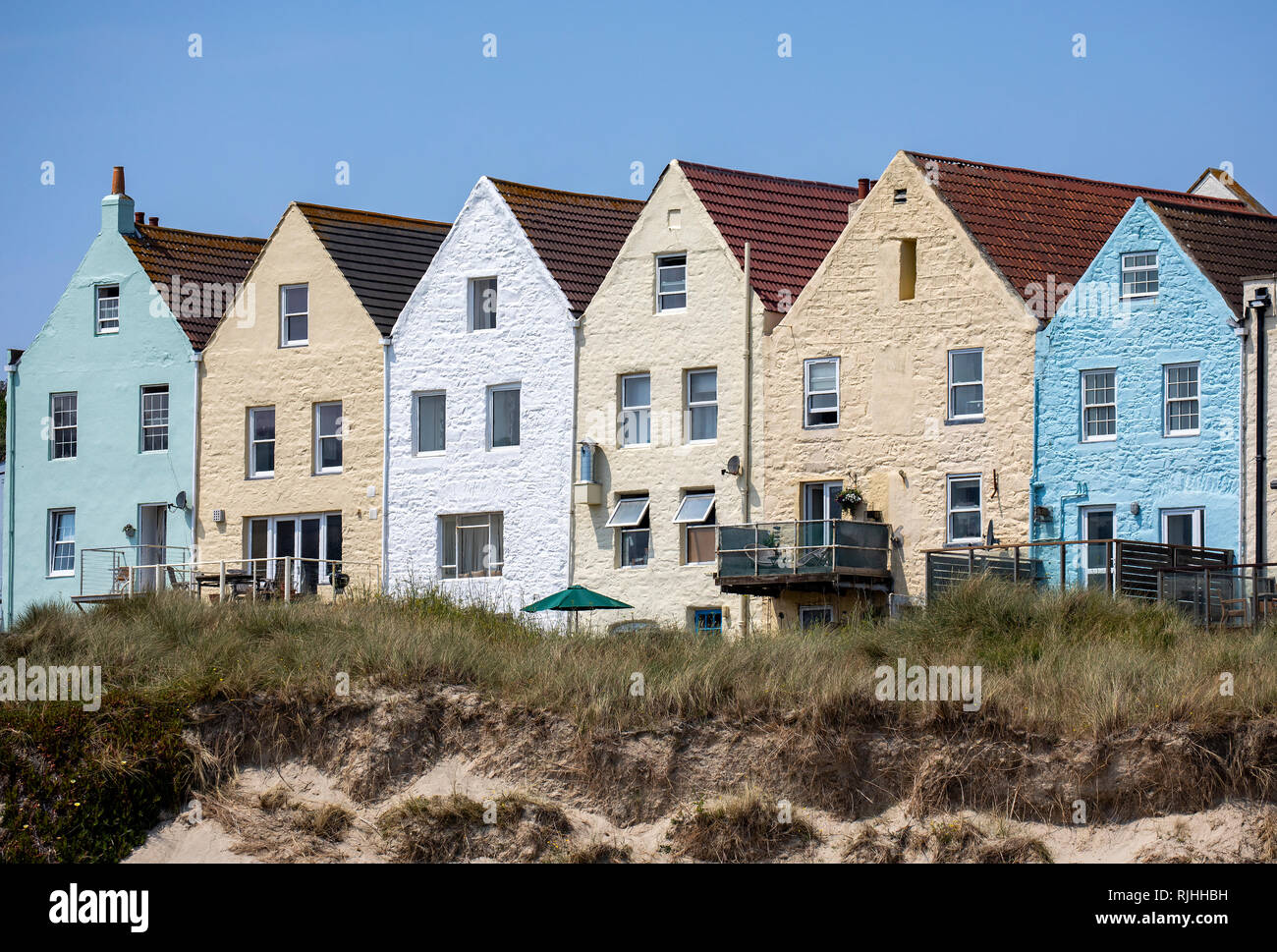 The English Row of colourful terraced houses near Braye Harbour on Alderney, providing both resteraunts and accommodation. Stock Photo